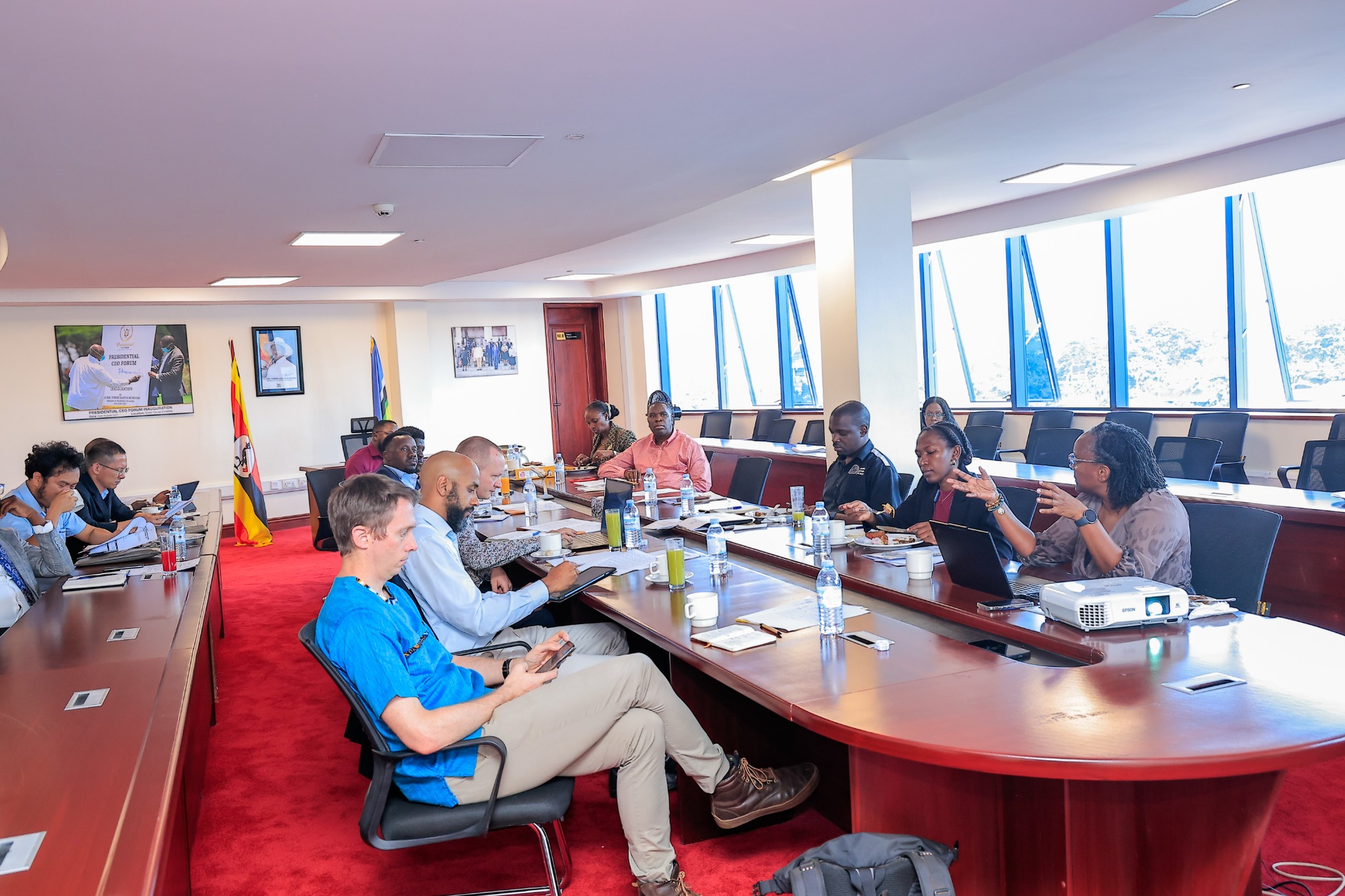 Stakeholders engage in informal discussions during a networking break at the E-Mobility Stakeholder Engagement Meeting hosted by the Presidential CEO Forum (PCF) in July 2026